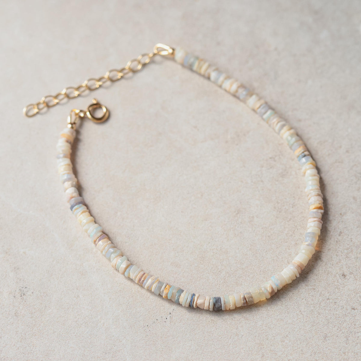 Australian Opal anklet by Earthly Abundance featuring a delicate chain with colorful opal gemstones for a stylish foot accessory.