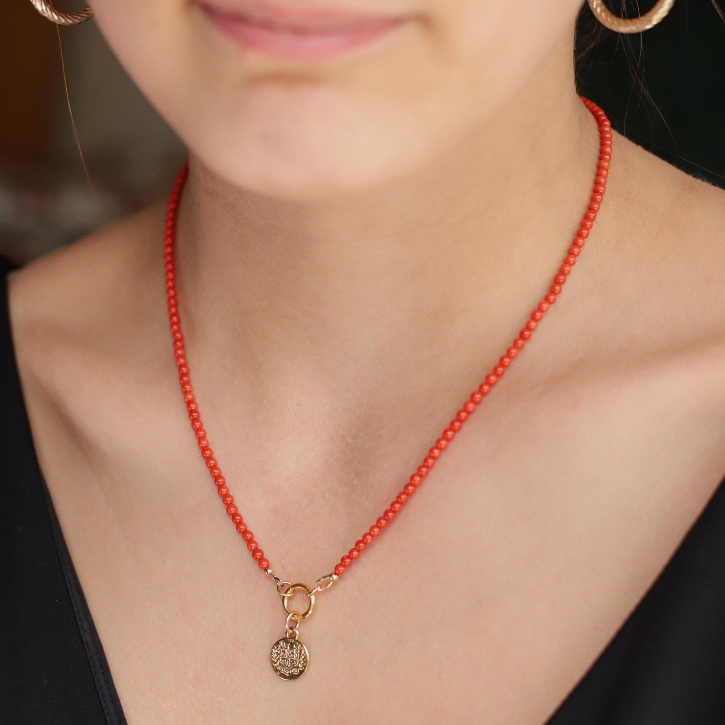 Italian Coral Greek necklace by Earthly Abundance featuring vibrant coral beads and intricate Greek-inspired design.