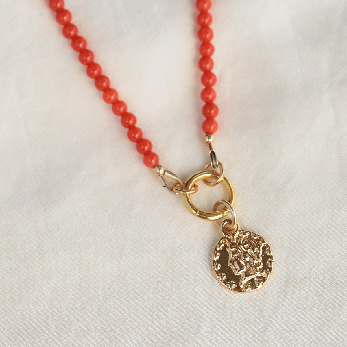 Italian Coral Greek necklace by Earthly Abundance featuring vibrant coral beads and intricate Greek-inspired design.