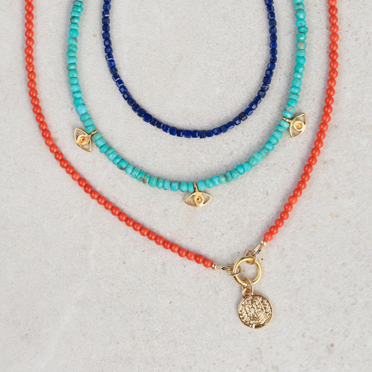 Italian Coral Greek necklace by Earthly Abundance featuring vibrant coral beads and intricate Greek-inspired design.