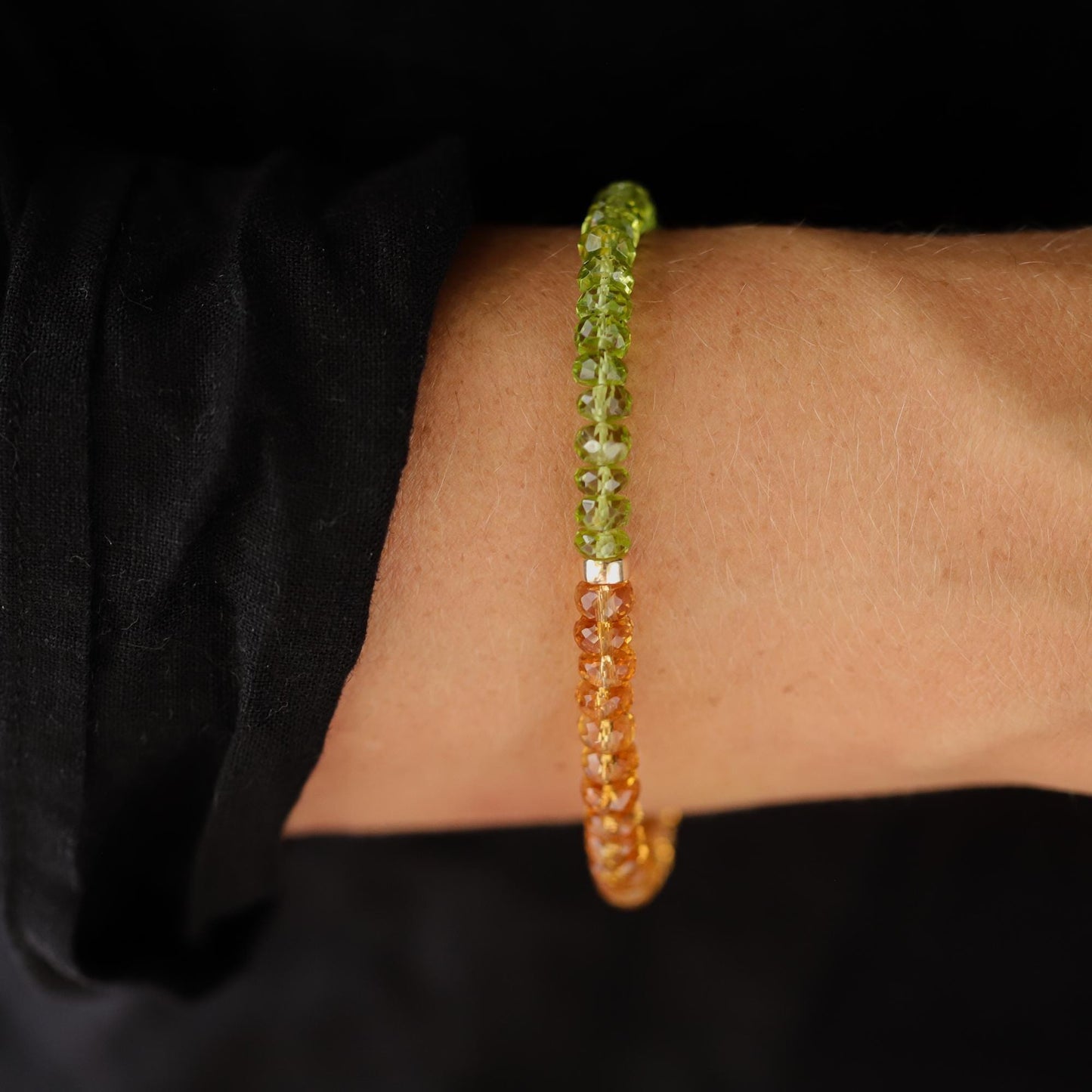Peridot and citrine bracelet with gold-tone clasp from Earthly Abundance, showcasing vibrant green and yellow gemstones on a delicate chain.