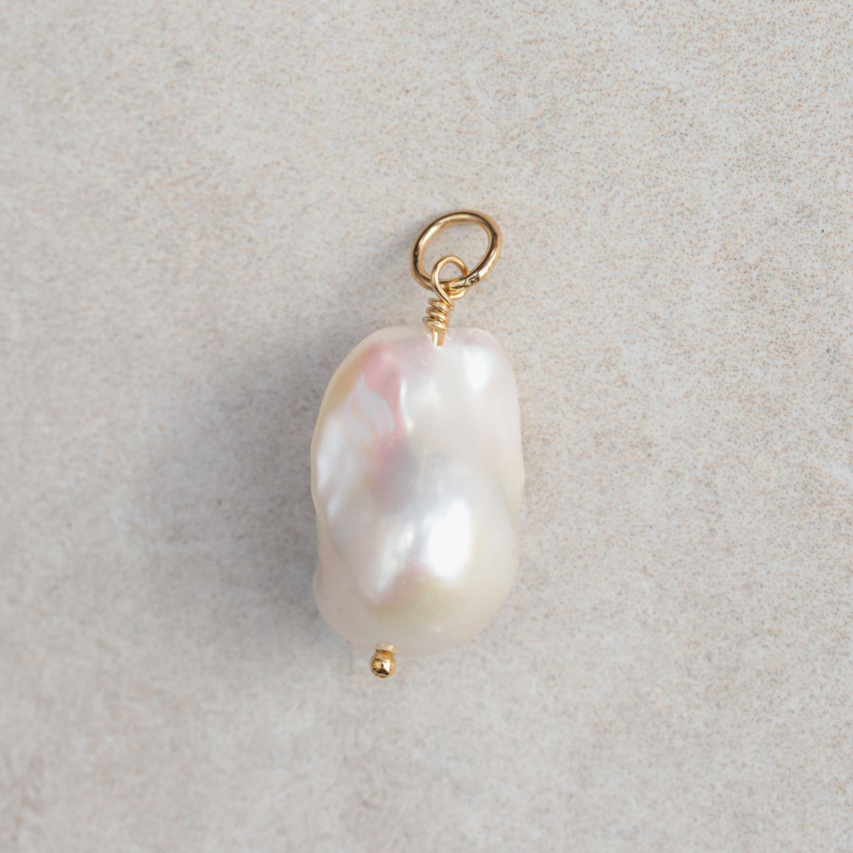 Aphrodite Baroque Pearl Pendant from Earthly Abundance featuring a large unique baroque pearl on a delicate chain.