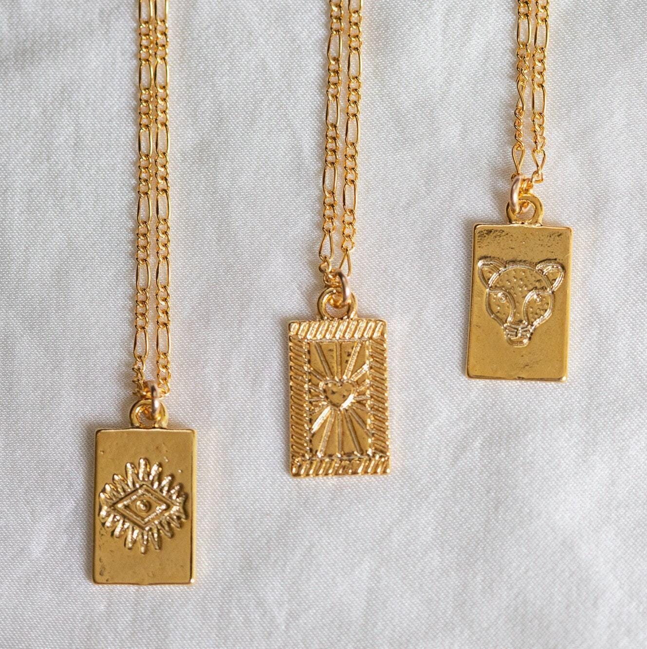 Gold rectangle necklace from Earthly Abundance Jewelry featuring a sleek rectangular pendant on a delicate chain.