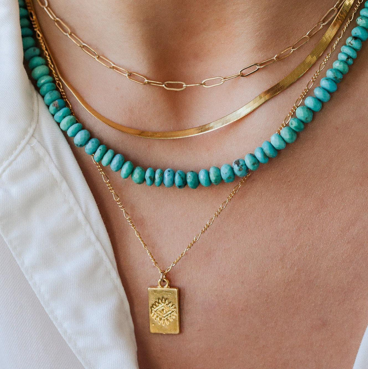 Gold rectangle necklace from Earthly Abundance Jewelry featuring a sleek rectangular pendant on a delicate chain.