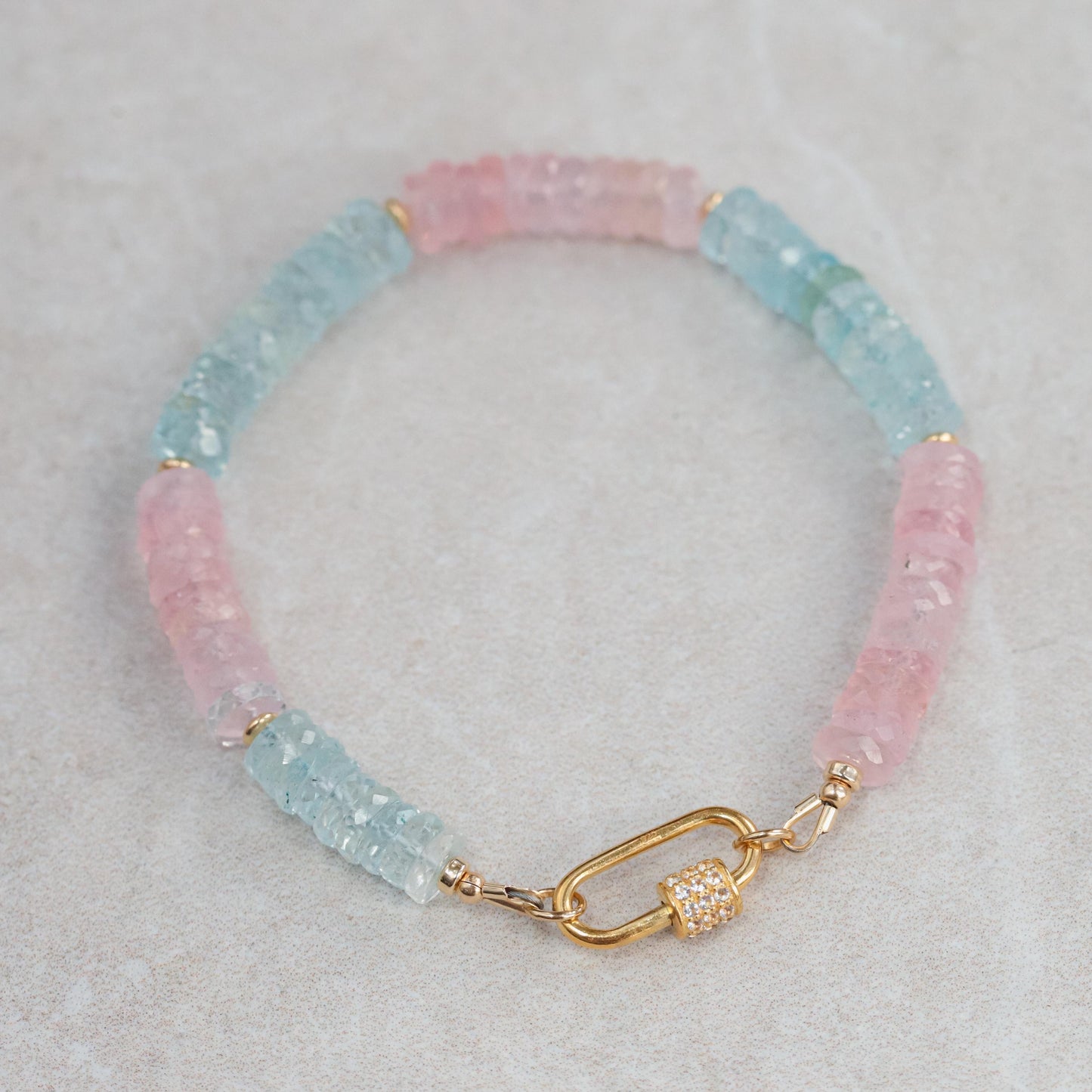 Earthly Abundance Morganite, Beryl, Topaz carabiner bracelet featuring colorful gemstone beads and silver-tone clasp.