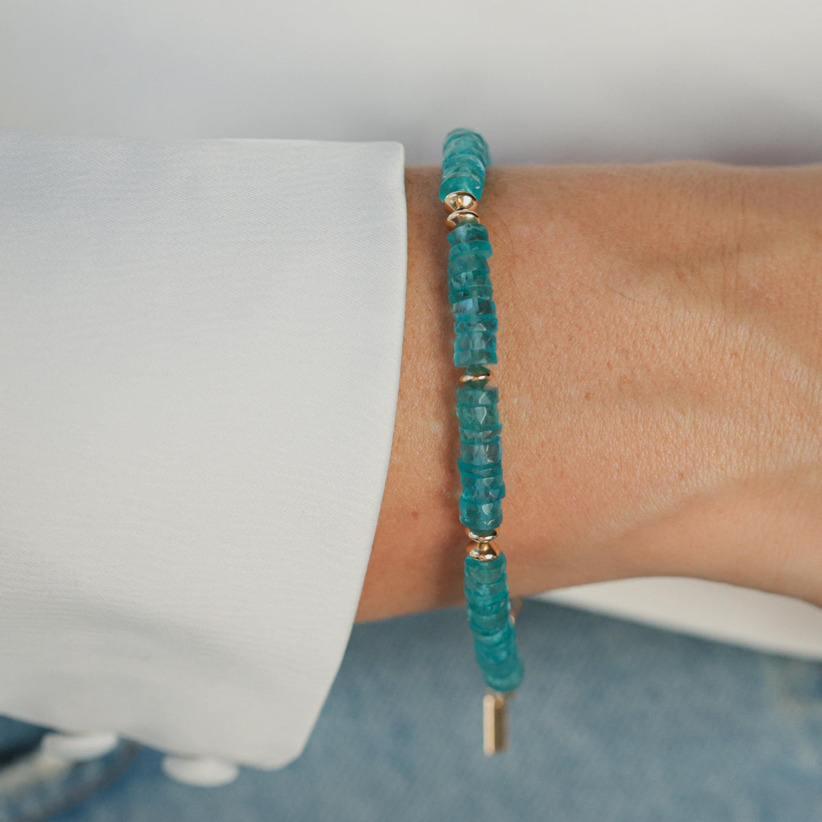 Neon Apatite bracelet with vibrant blue-green beads from Earthly Abundance, featuring a stretchy elastic band.