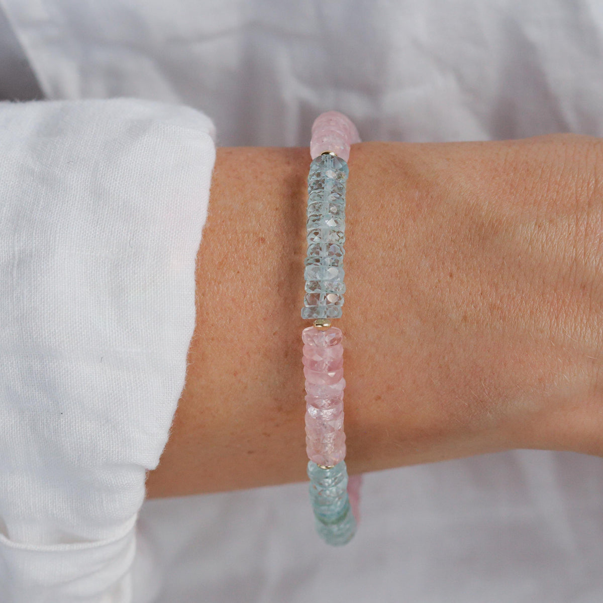 Earthly Abundance Morganite, Beryl, and Topaz carabiner bracelet featuring colorful gemstone beads and silver-toned hardware.