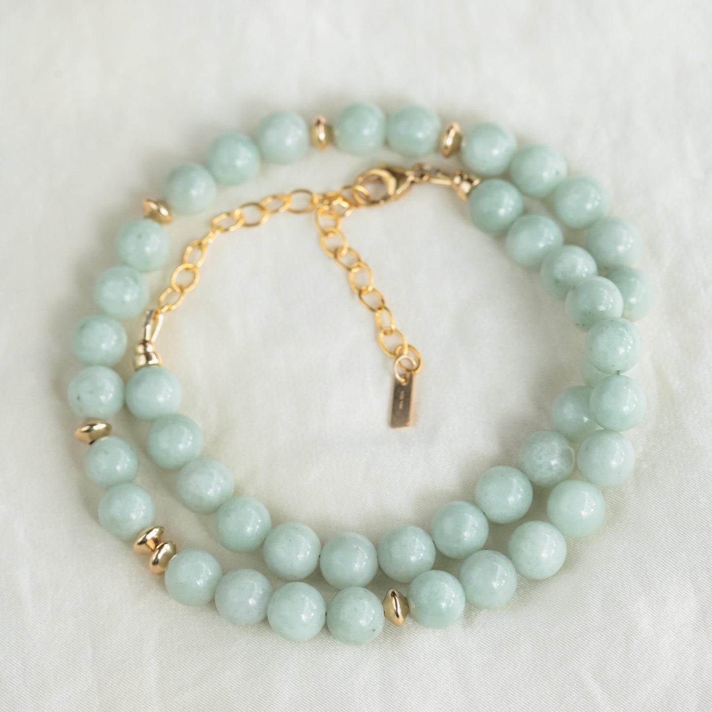Elegant Serene Jadeite necklace by Earthly Abundance featuring smooth, polished jadeite stones on a delicate chain.