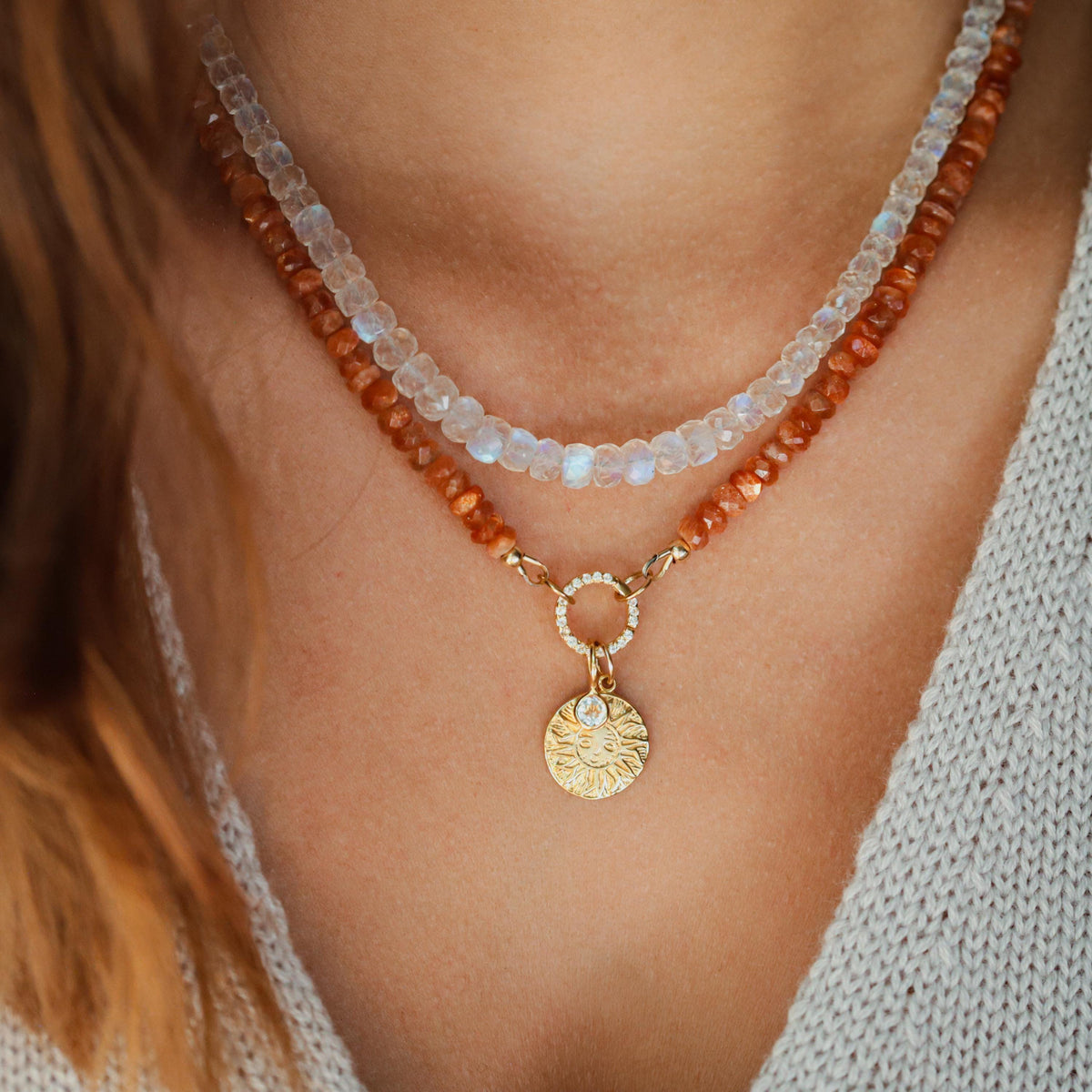 Earthly Abundance Moonspell Moonstone Necklace featuring a polished moonstone pendant on a delicate chain.