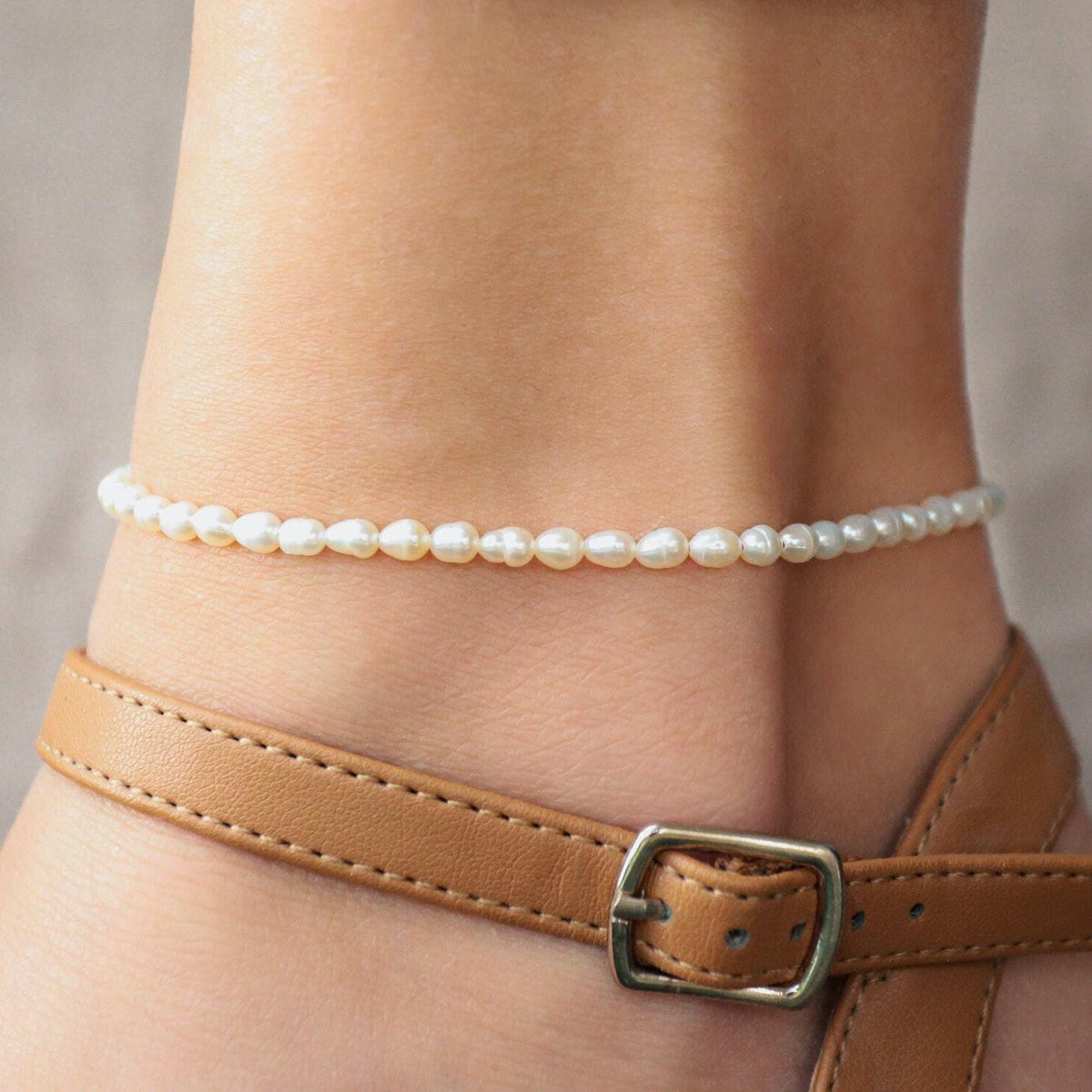Fresh water pearl anklet with 14K gold chain from Earthly Abundance, featuring delicate white pearls on a stylish anklet.