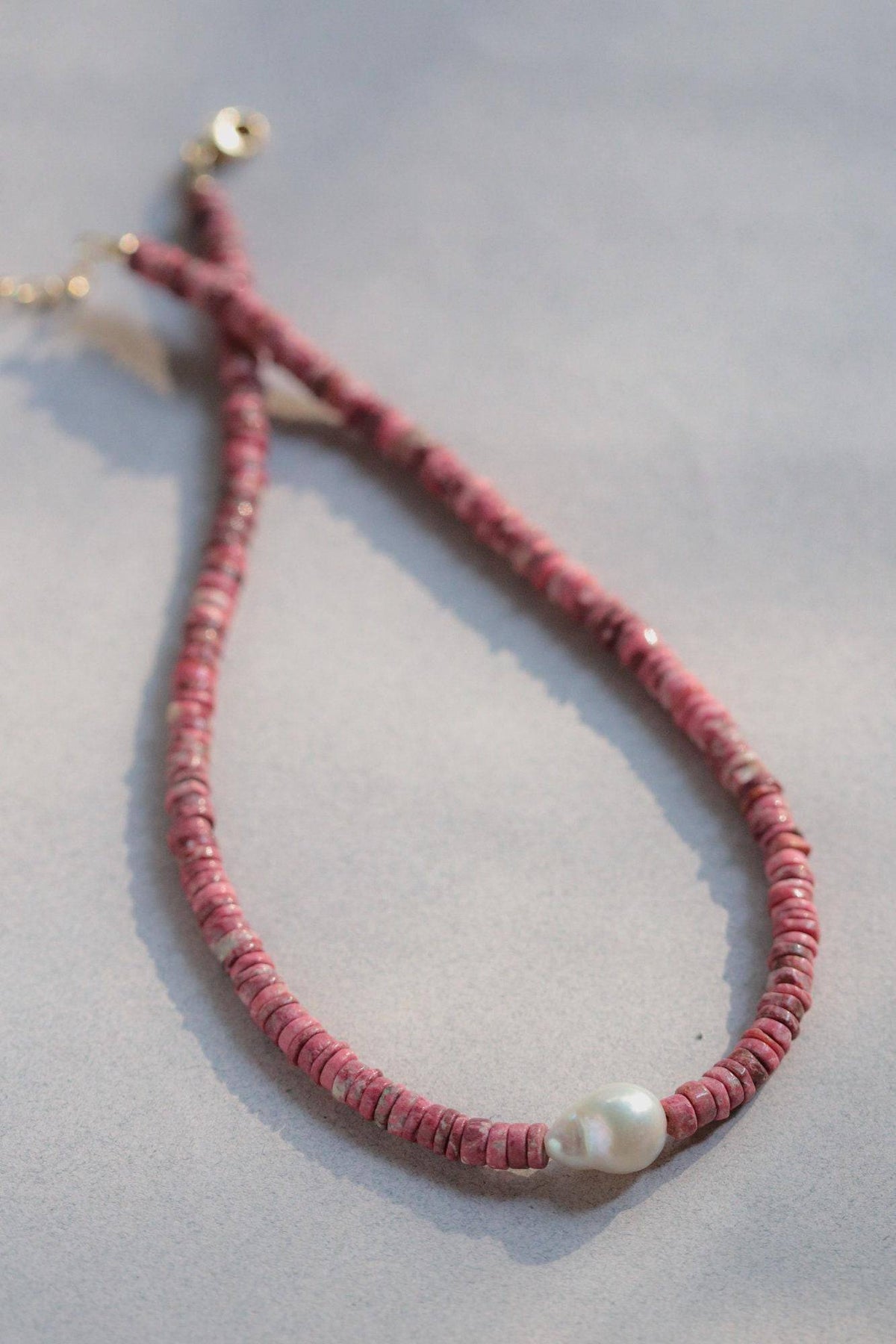 Pink Thulite pearl necklace from Earthly Abundance Jewelry featuring pink gemstones and elegant pearl accents.