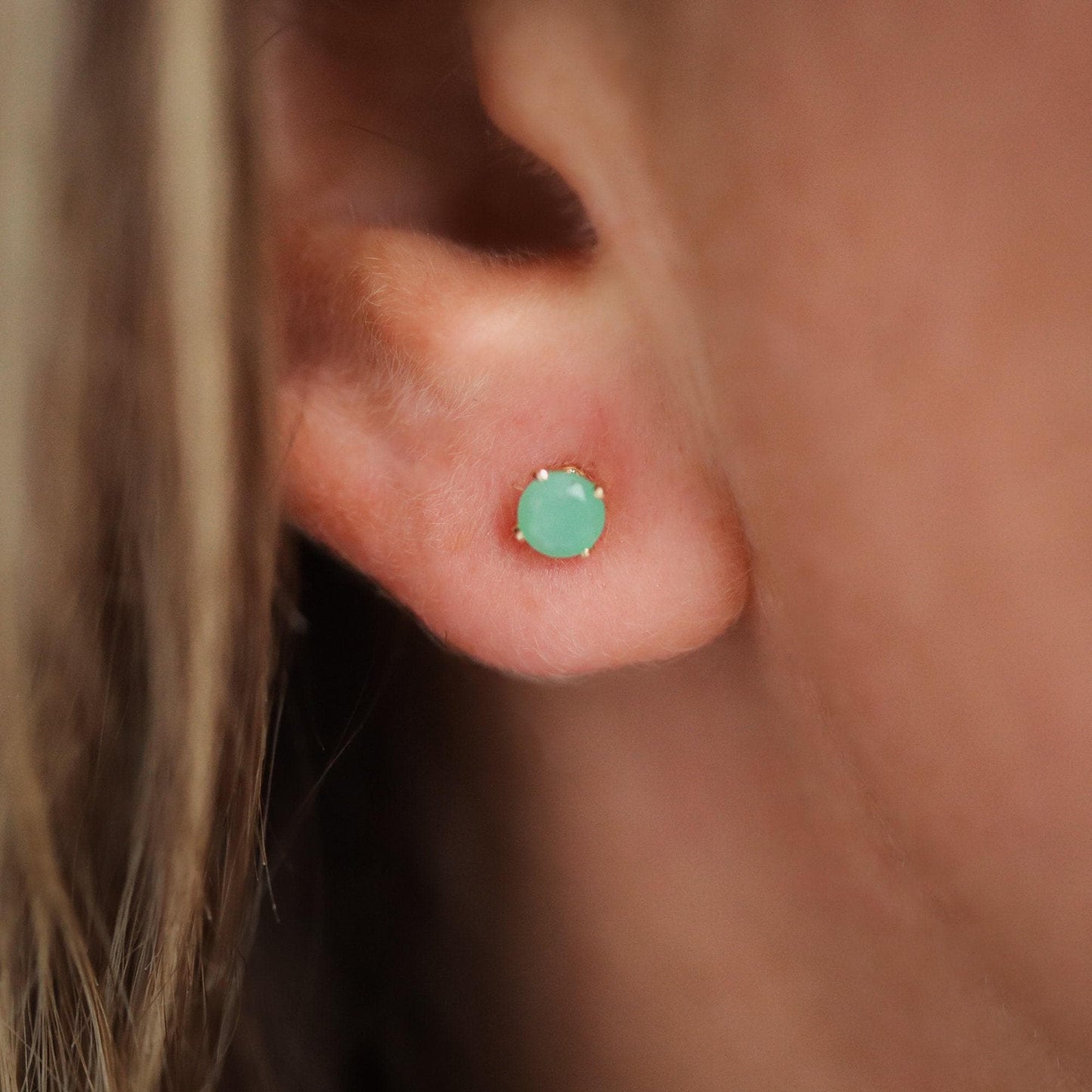 Chrysoprase stud earrings by Earthly Abundance featuring vibrant green gemstone studs on a simple metal setting.