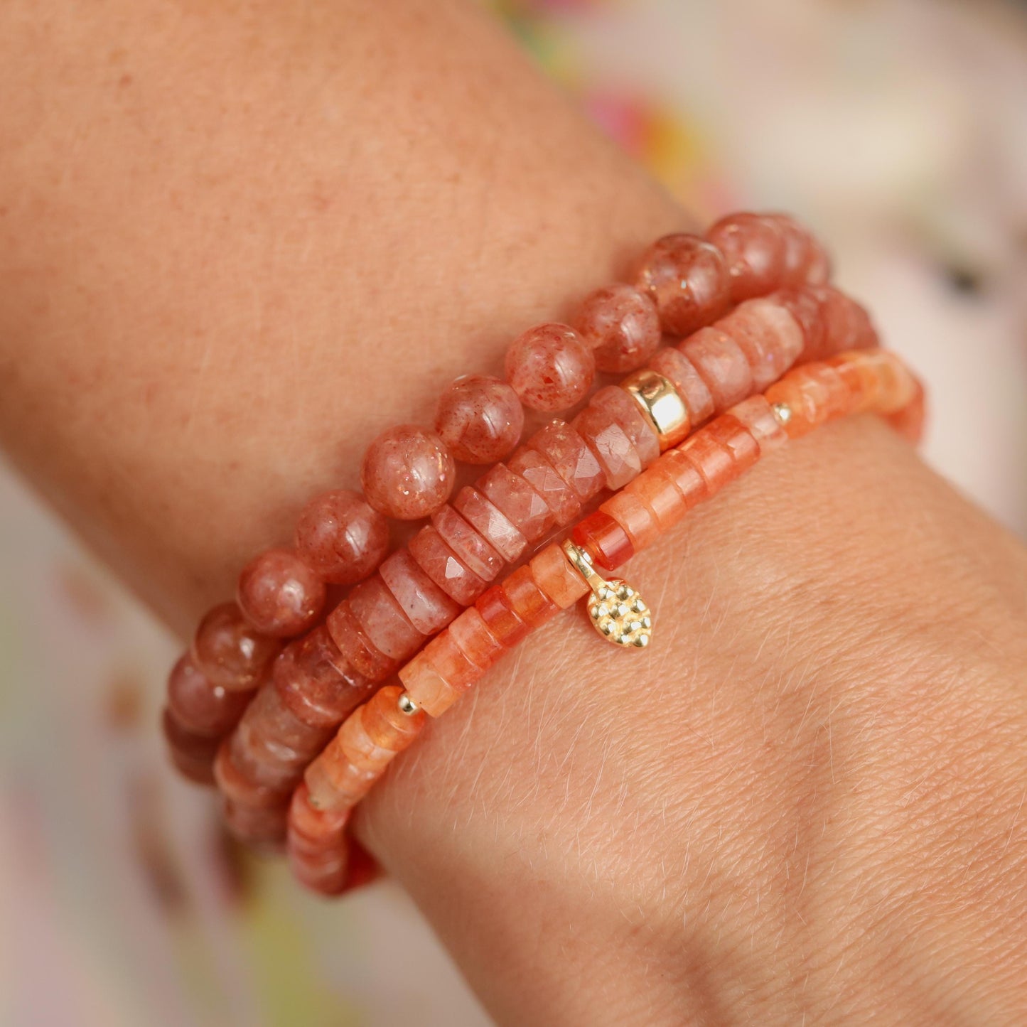 Earthly Abundance Sunstone Heishi bracelet featuring small round sunstone beads on an elastic cord.