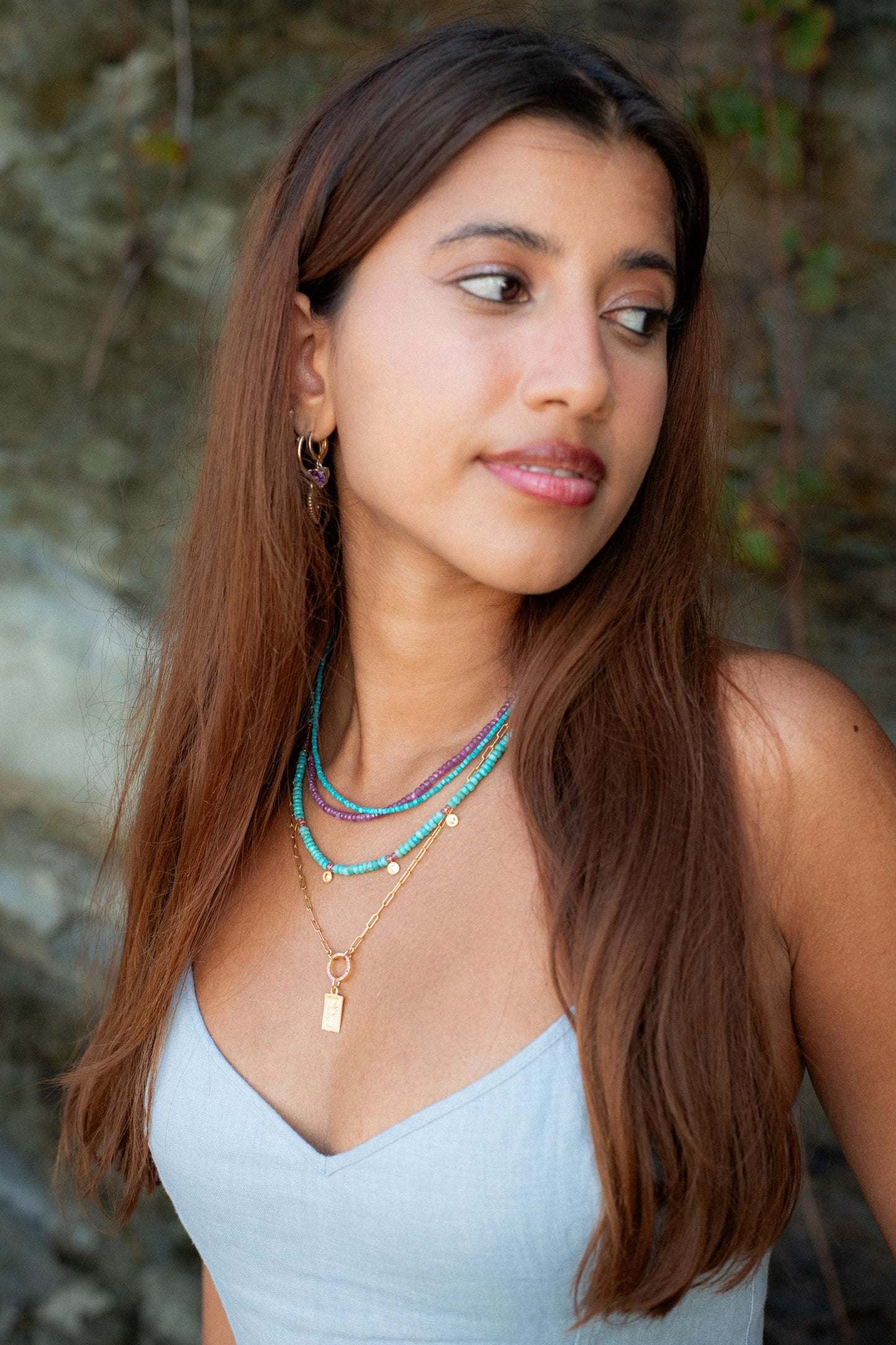 Turquoise cube necklace by Earthly Abundance featuring a polished turquoise stone pendant on a silver chain.