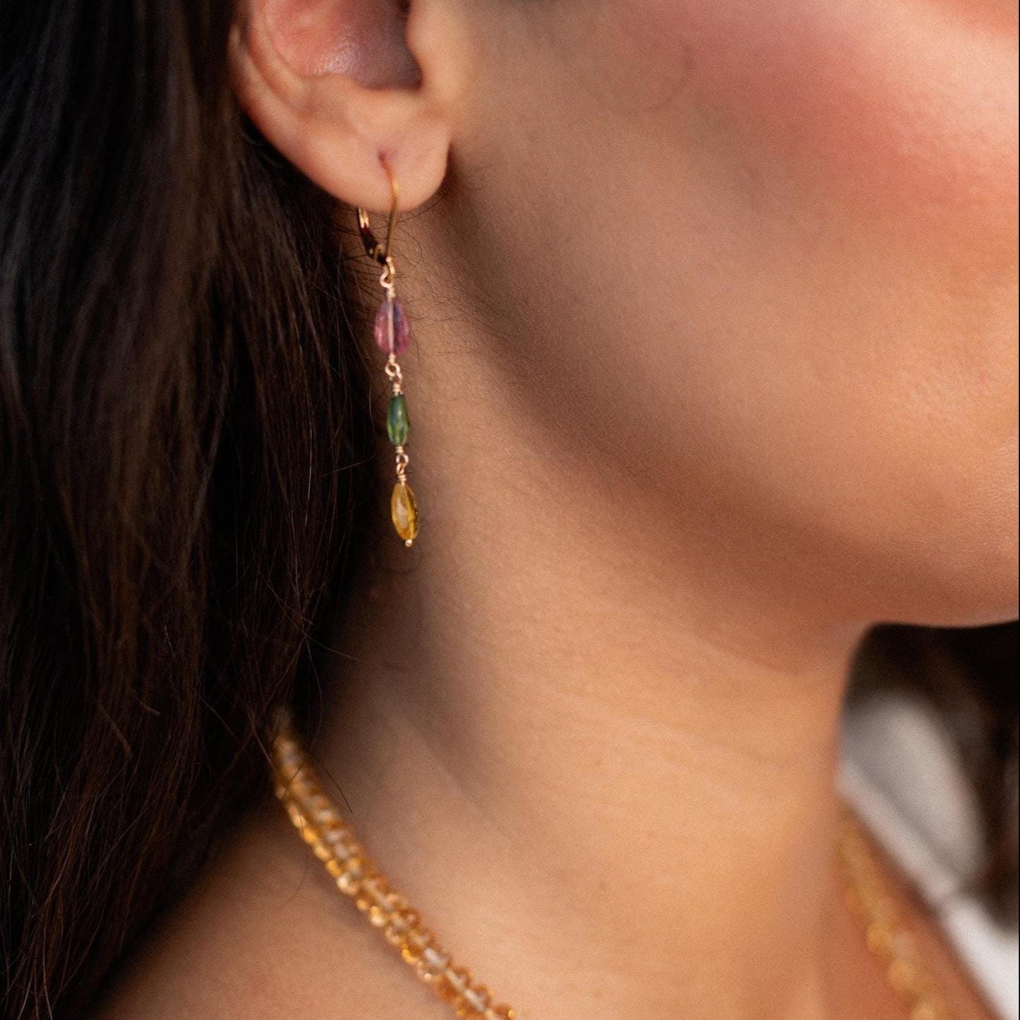 Delicate mixed tourmaline drop earrings by Earthly Abundance featuring colorful gemstone drops hanging from silver hooks.