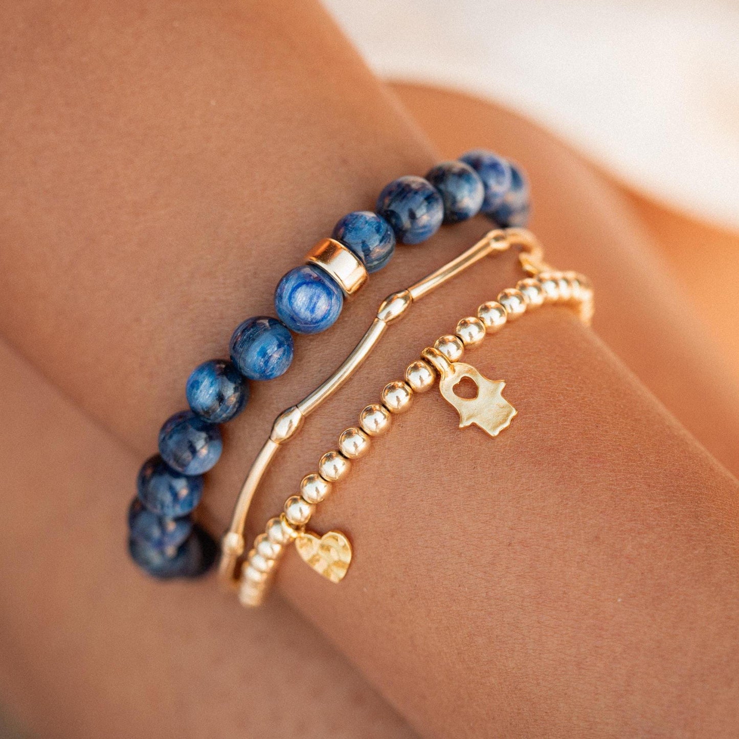 Kyanite bracelet from Earthly Abundance Jewelry featuring polished blue kyanite stones on an elastic band.