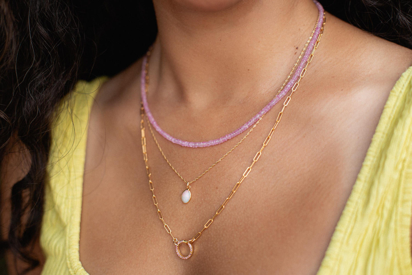 Pink sapphire necklace by Earthly Abundance featuring a delicate string of pink sapphires on a fine chain.