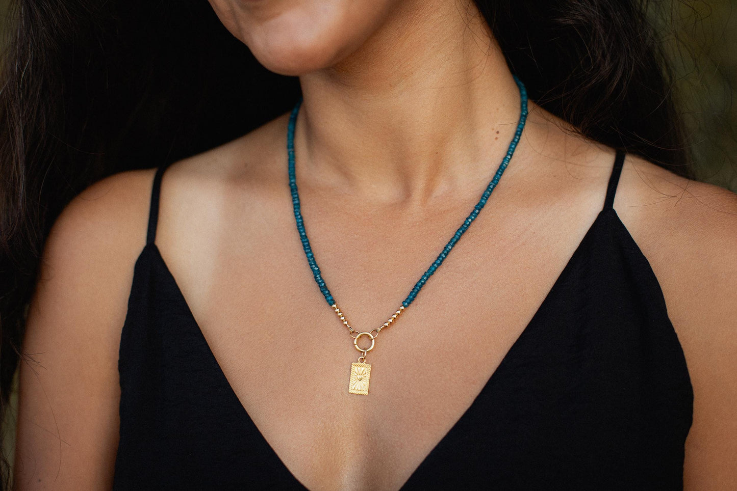 Oceanic Apatite Carabiner Necklace with silver chain from Earthly Abundance, featuring a vibrant blue-green apatite gemstone pendant.