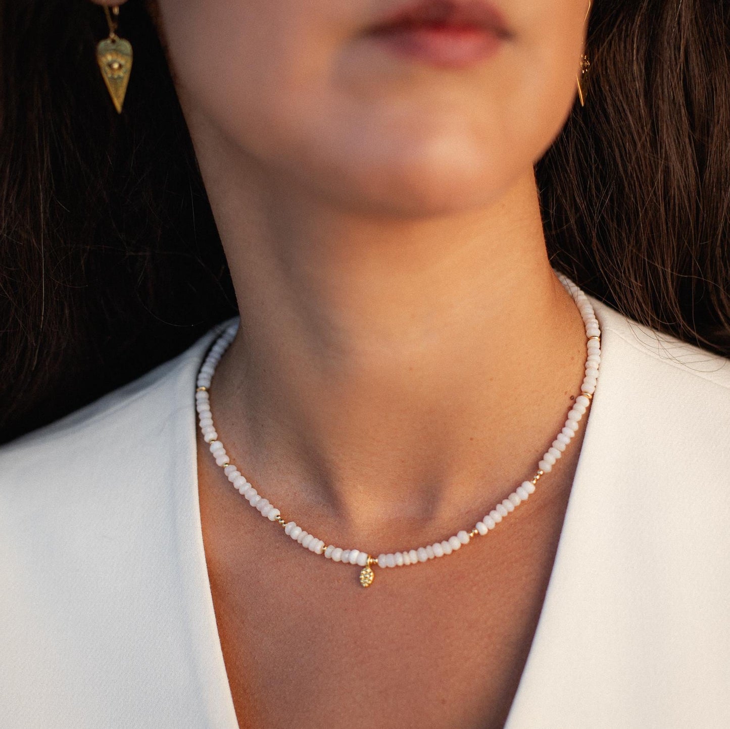 Delicate pink opal necklace from Earthly Abundance featuring a soft pink gemstone pendant on a fine chain.