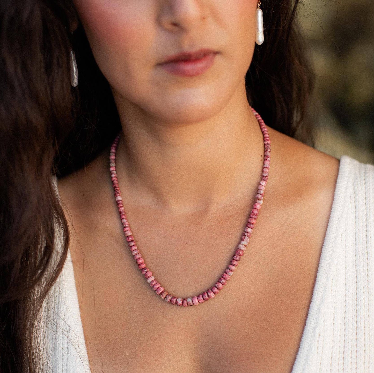 Pink Thulite beaded necklace by Earthly Abundance featuring round pink gemstone beads on a delicate string.