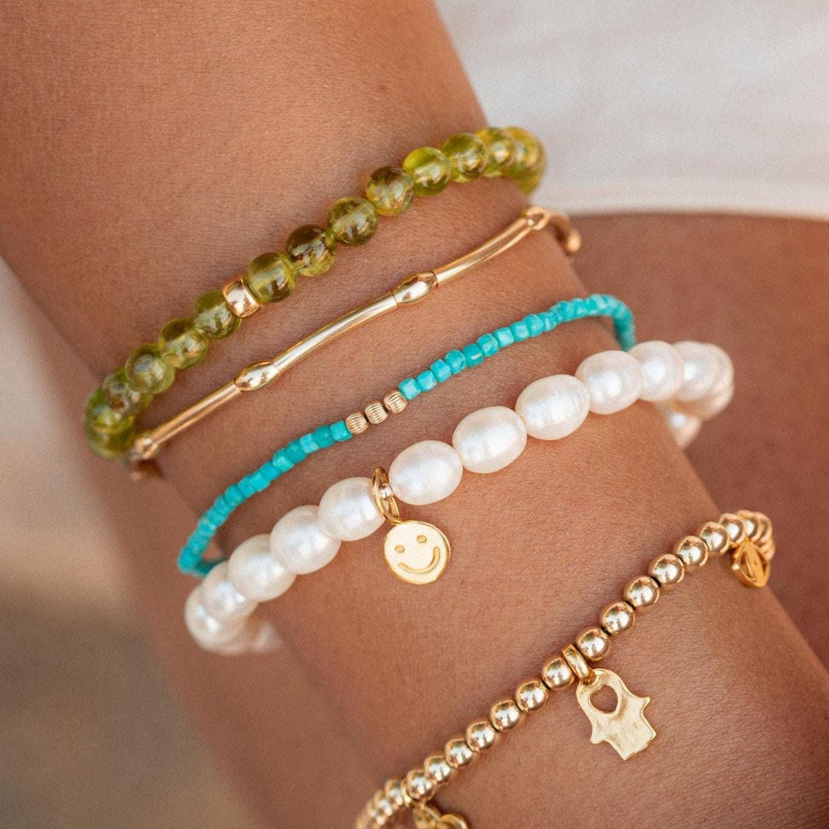 Happy Face Freshwater Pearl bracelet by Earthly Abundance featuring elegant white pearls on a delicate jewelry chain