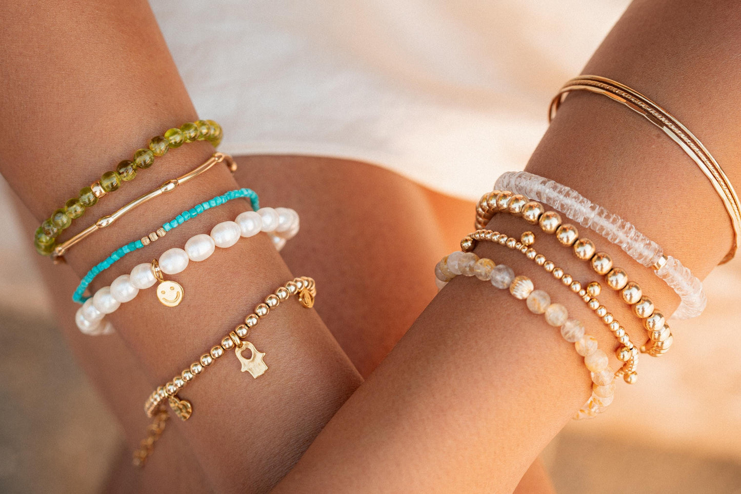 Earthly Abundance Happy Face freshwater pearl bracelet featuring a cheerful face charm on a string of lustrous pearls.