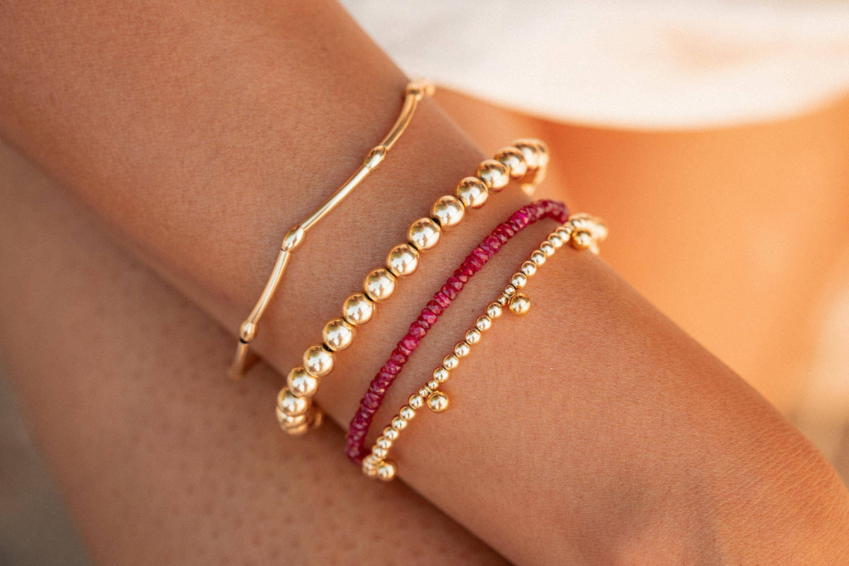 Carmine Longido Ruby bracelet by Earthly Abundance featuring vibrant red ruby beads on a delicate string.
