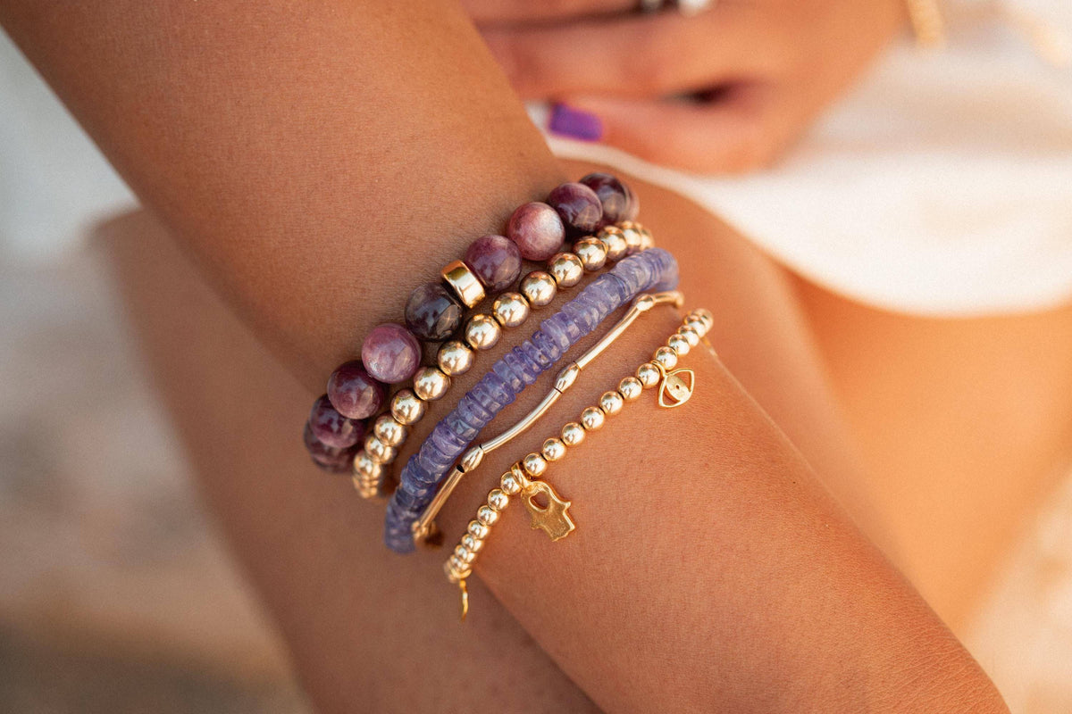 Earthly Abundance Jewelry Tanzanite bracelet featuring vibrant blue-purple tanzanite gemstones on a delicate silver chain.