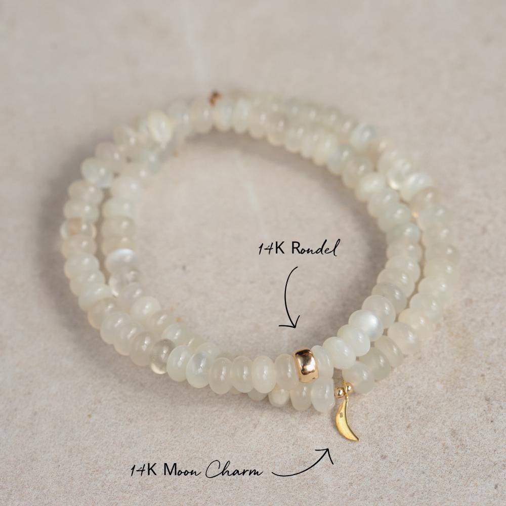White creamy moonstone bracelet from Earthly Abundance featuring smooth, polished moonstone beads on a delicate stretch cord.