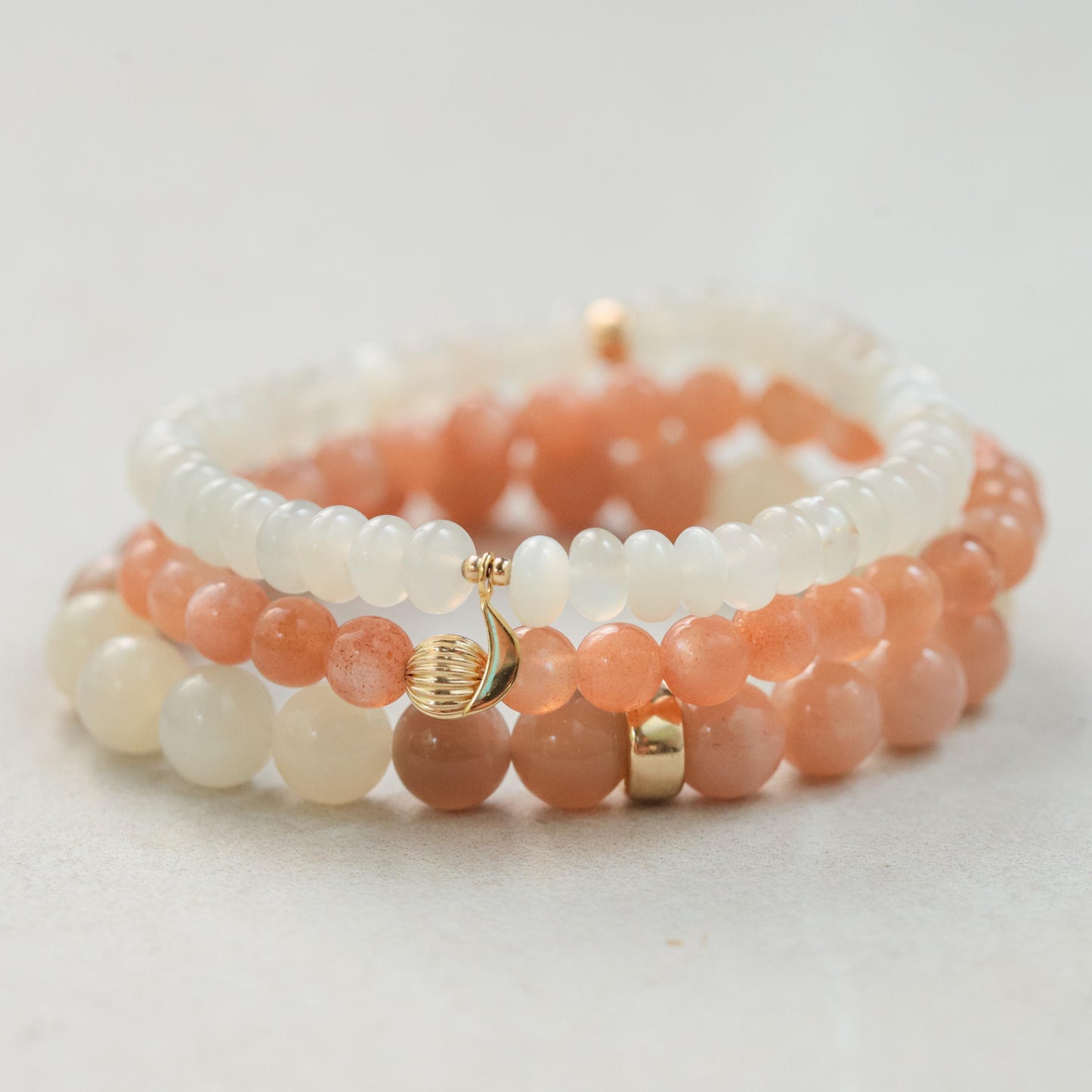 Earthly Abundance Desert Moon bracelet featuring moonstone beads and silver accents, displayed on a neutral background.