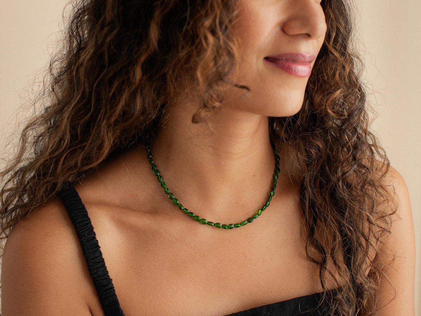 Chrome Diopside necklace with 14K gold chain from Earthly Abundance, featuring a polished green gemstone pendant.