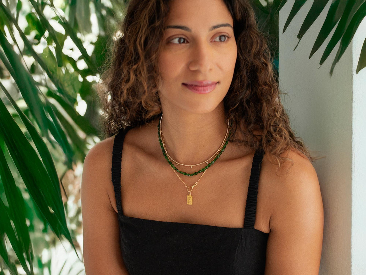 Chrome Diopside necklace with a 14K gold setting, featuring a vibrant green gemstone and delicate chain.
