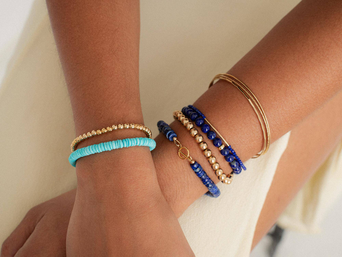 Lapis Lazuli bracelet featuring deep blue stones with gold flecks, crafted by Earthly Abundance Jewelry.