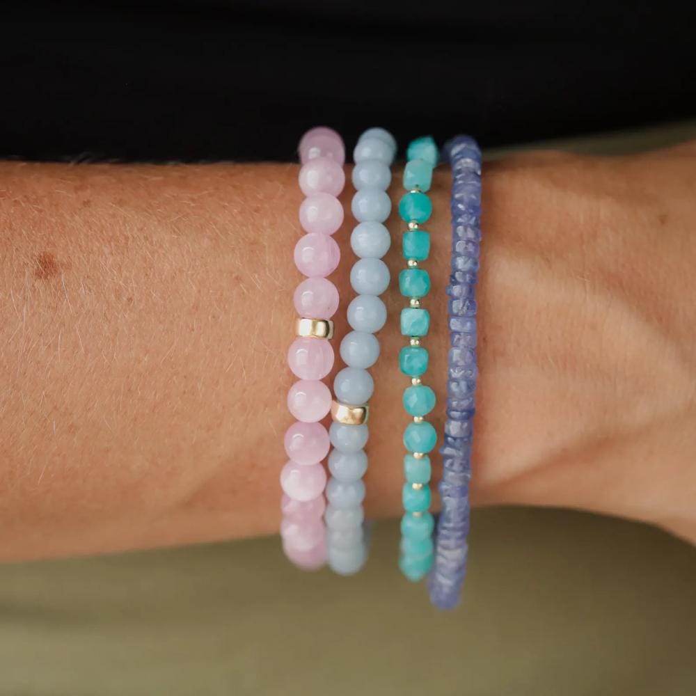 Amazonite bracelet featuring a moon charm by Earthly Abundance, showcasing smooth blue-green beads and a detailed moon pendant.