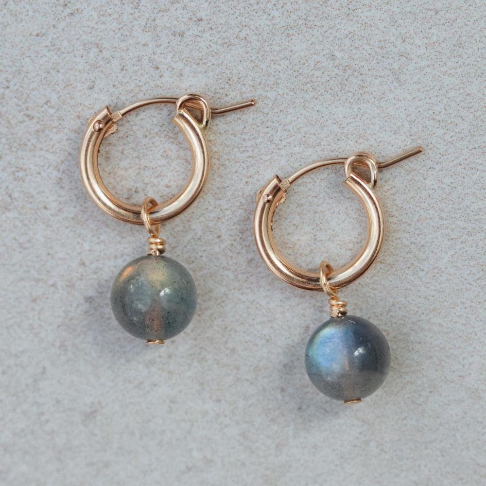 Labradorite ball hoop earrings with 14K gold-filled posts, featuring polished Labradorite stones on gold hoops.