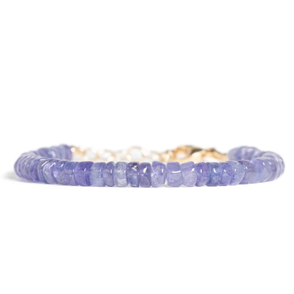 Earthly Abundance Jewelry Tanzanite bracelet with oval blue gemstones and silver setting, displayed on a neutral background.