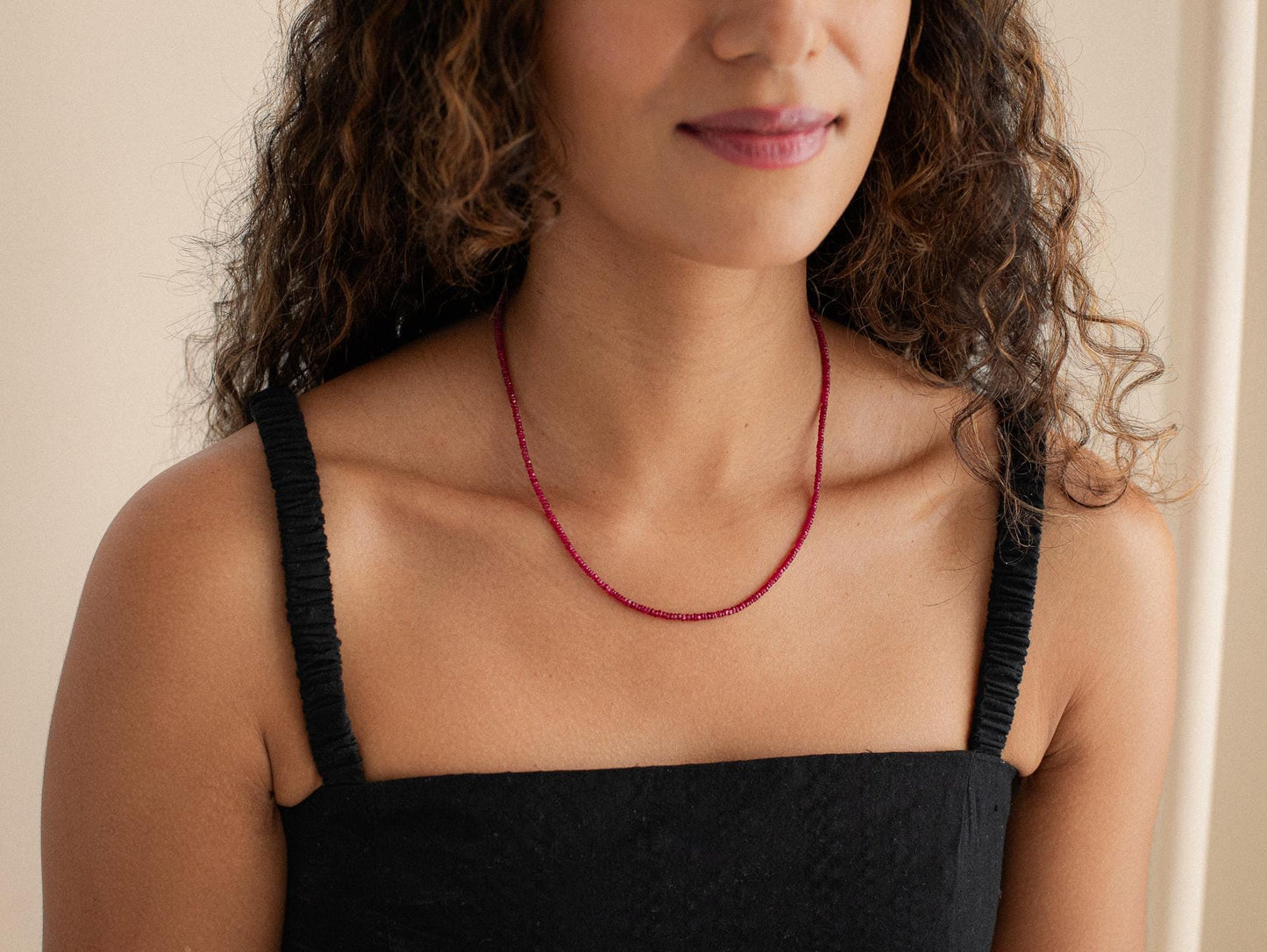 14K Anchor Ruby Necklace by Earthly Abundance featuring a polished anchor pendant with a vibrant ruby gemstone.