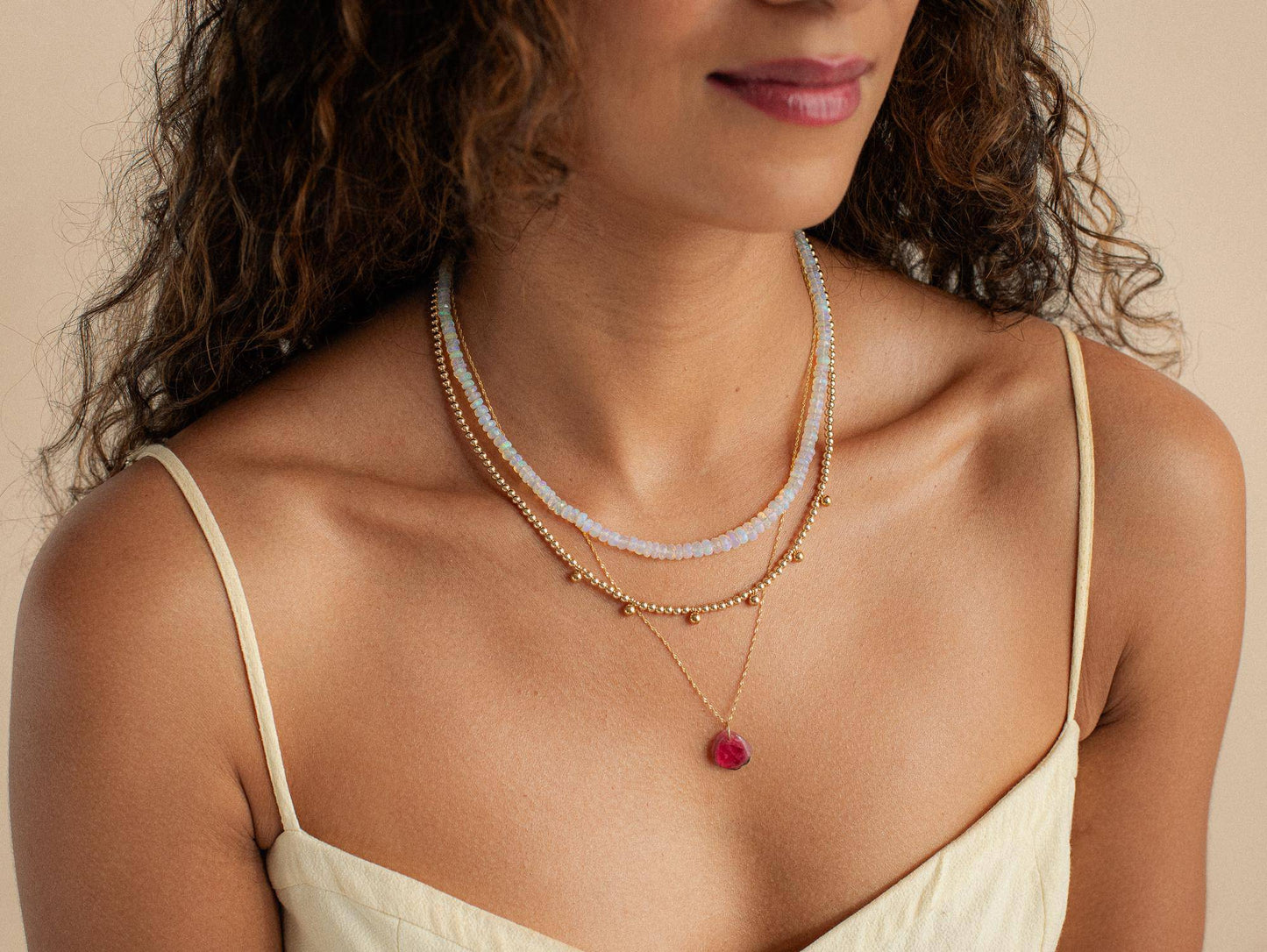 Ethiopian Opal beaded necklace from Earthly Abundance Jewelry showcasing vibrant, colorful opal beads on a delicate string.