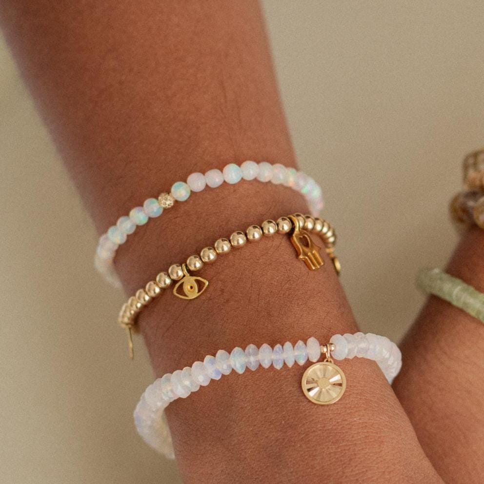 Ethiopian Opal Pyramid Bracelet with 14K gold accents from Earthly Abundance, featuring a row of pyramid-shaped opal beads.