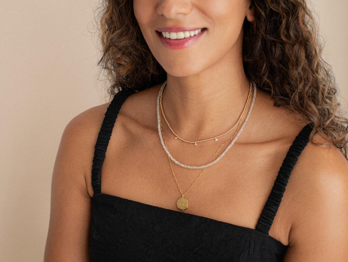 Earth Elegance Zircon Necklace by Earthly Abundance featuring sparkling zircon stones on a delicate chain.