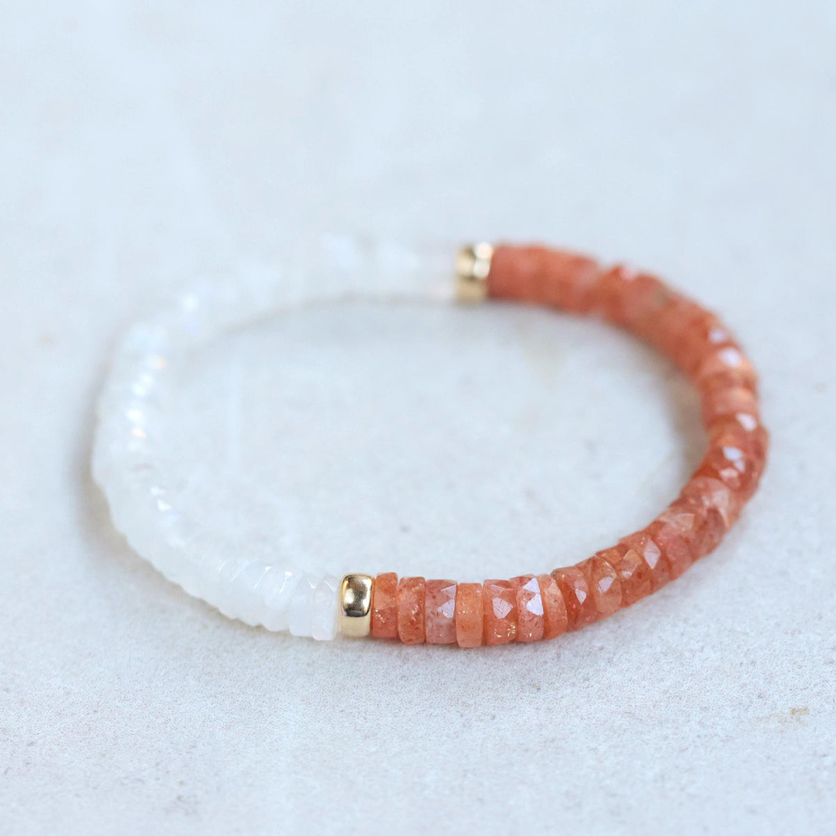 Dawn & Dusk Bracelet by Earthly Abundance featuring sunstone and moonstone beads on a delicate elastic band.
