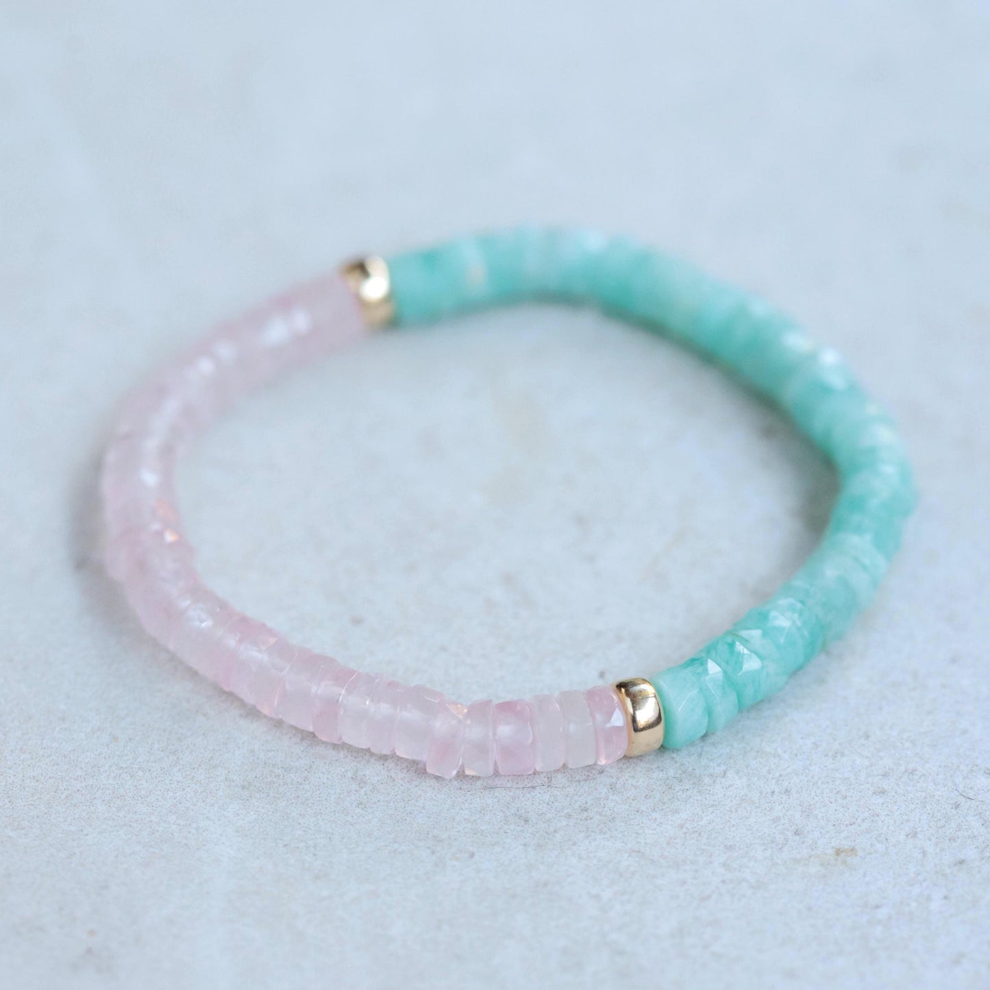 Earthly Abundance Amazonite and Rose Quartz Heishi bracelet featuring small, colorful gemstone beads on a stretchy band.