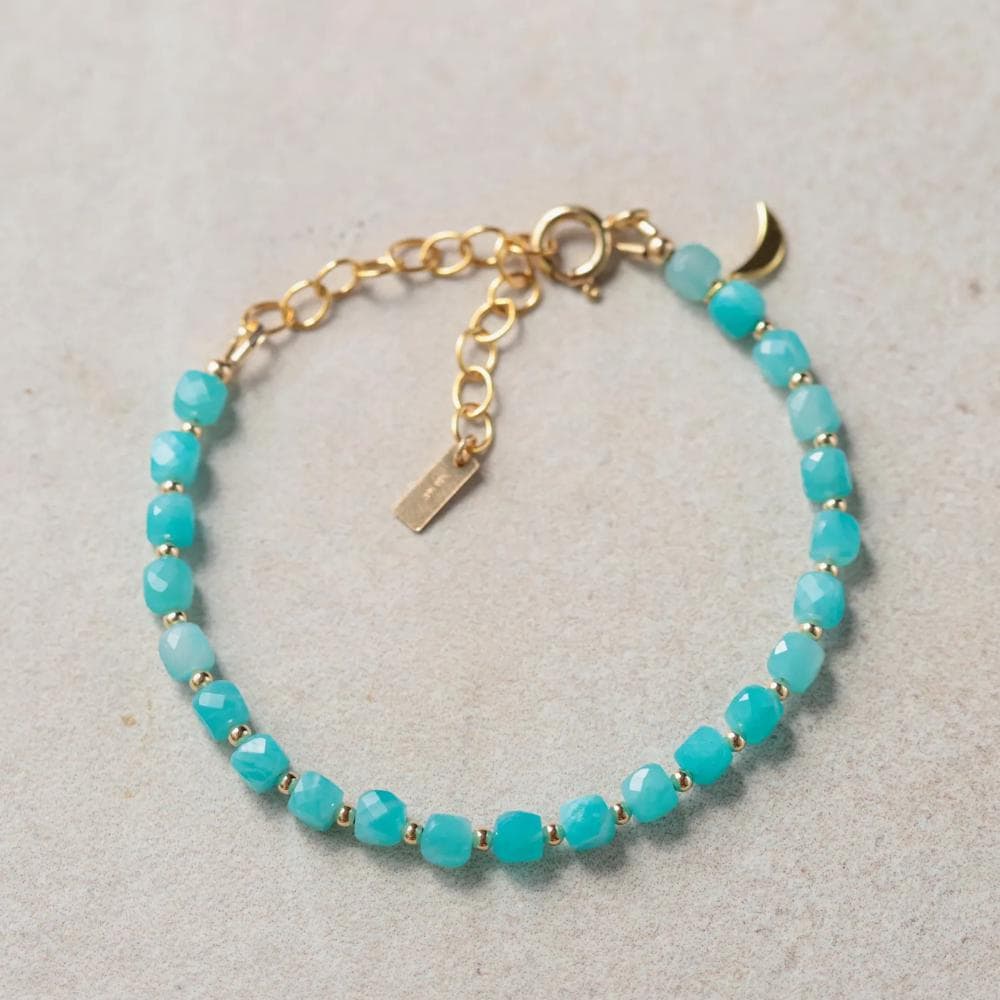 Amazonite bracelet with a moon charm from Earthly Abundance featuring polished blue-green stones and a silver moon pendant.