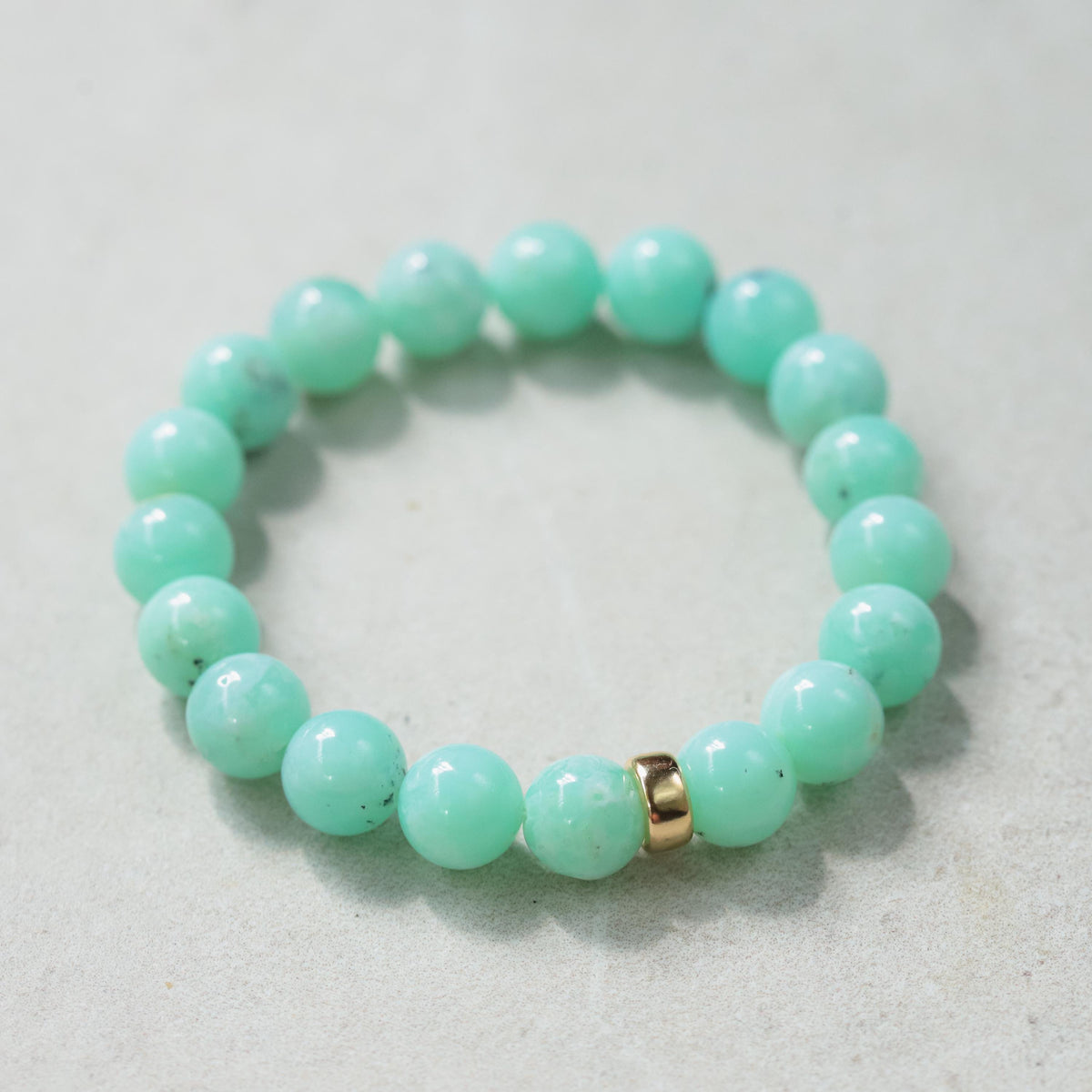 Chrysoprase bracelet with 14K gold clasp from Earthly Abundance, featuring vibrant green gemstone beads and elegant design.