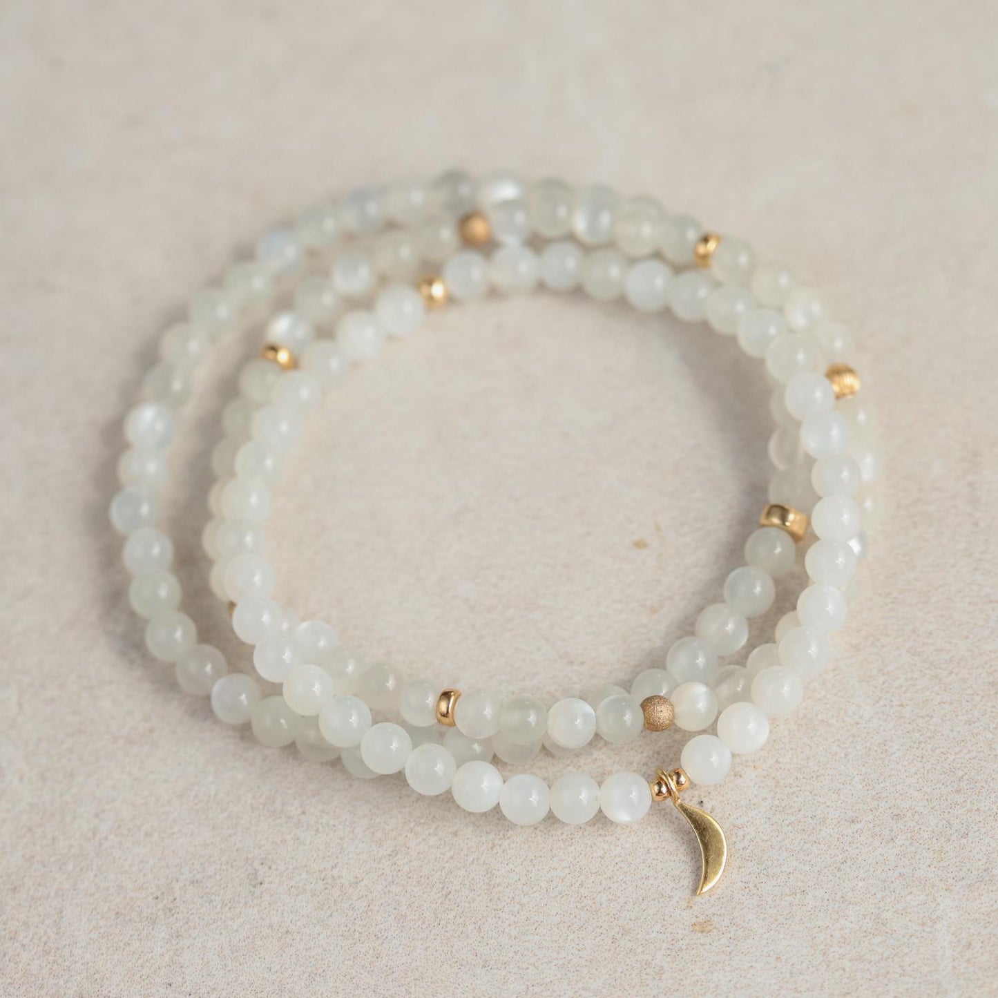 Elegant moonstone bracelet with 14K gold setting from Earthly Abundance Jewelry, featuring smooth, luminous moonstone beads.