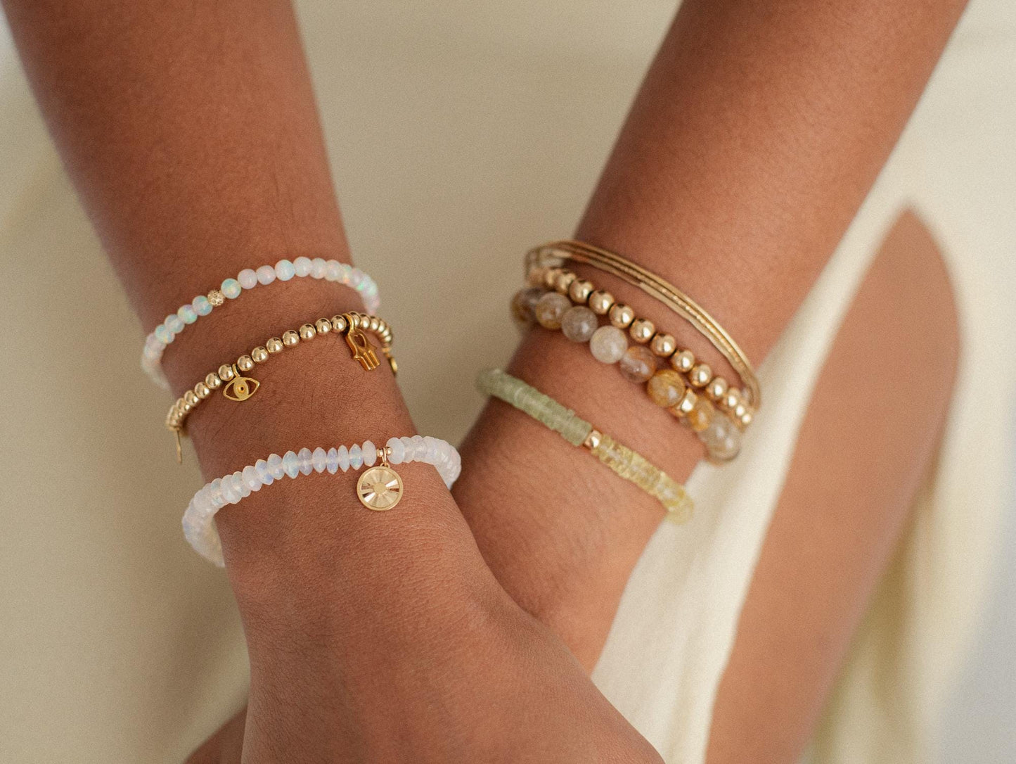 8mm Golden rutilated quartz bracelet from Earthly Abundance featuring polished golden quartz beads with needle-like rutile inclusions.