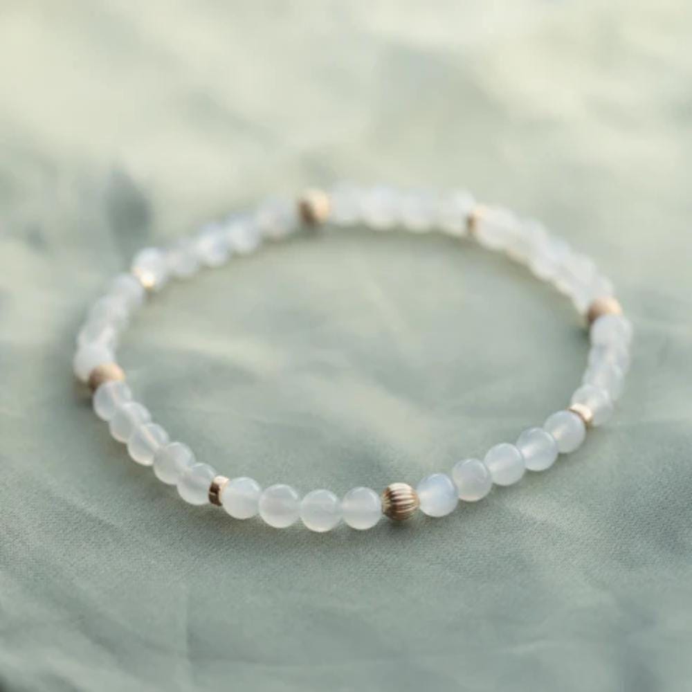 14K moonstone bracelet by Earthly Abundance Jewelry featuring smooth, glowing moonstone beads on a delicate chain.