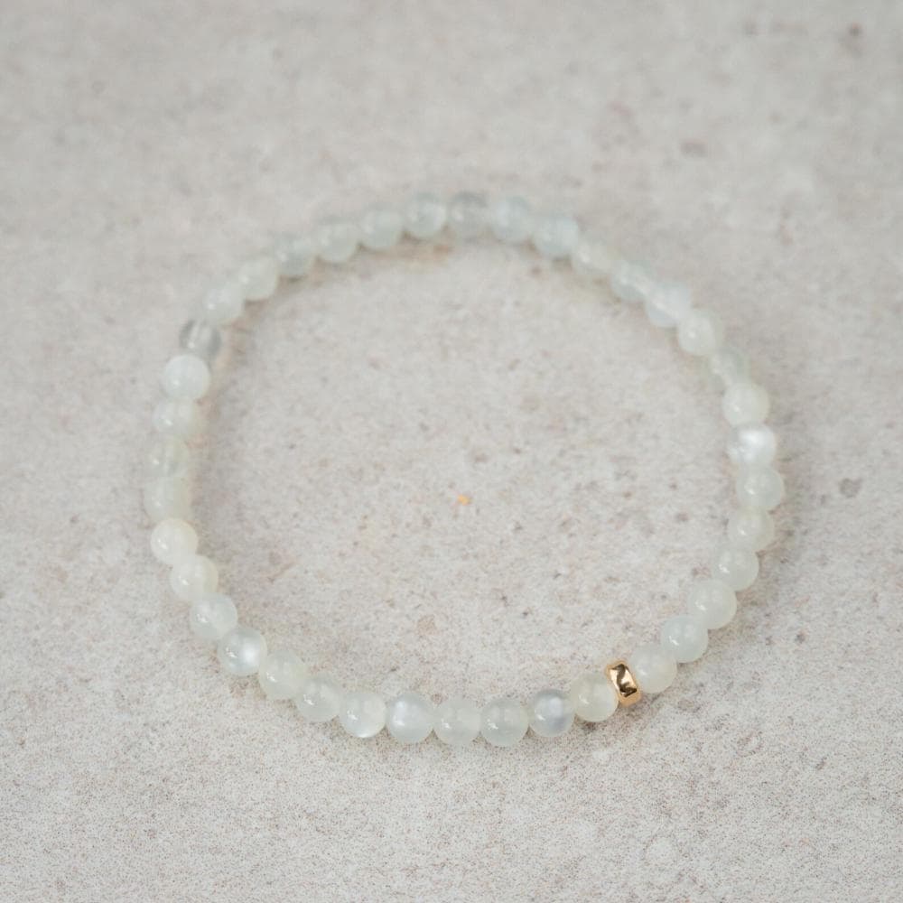 Handcrafted moonstone bracelet with 14K gold accents from Earthly Abundance Jewelry, showcasing smooth, luminous moonstone beads.