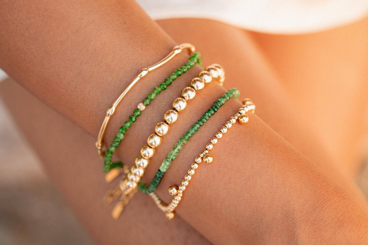 Chrome Diopside gemstone set in 14K gold from Earthly Abundance, showcasing its rich green color and polished, faceted surface.