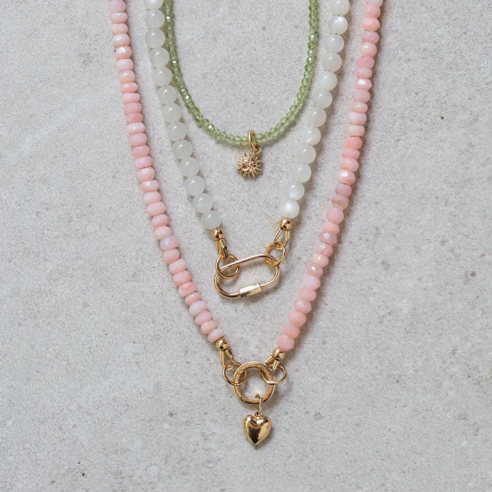 Earthly Abundance Luna Lock necklace featuring a silver crescent moon pendant on a delicate chain.